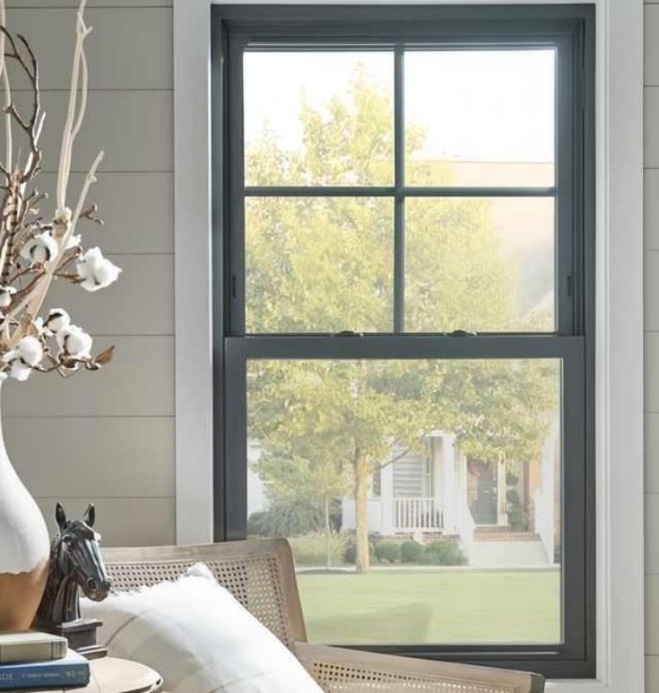 PAhome aluminum double-hung window with divided grid design overlooking green yard