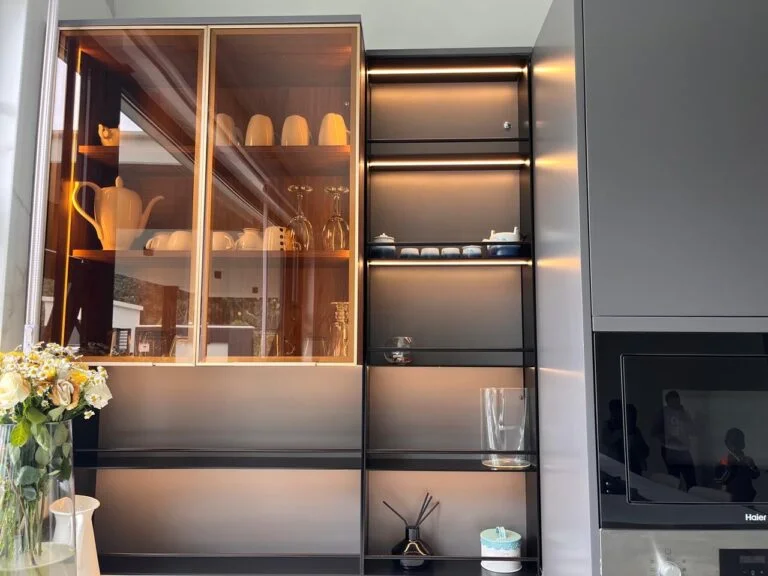 kitchen display cabinet with tinted glass doors and backlit shelves