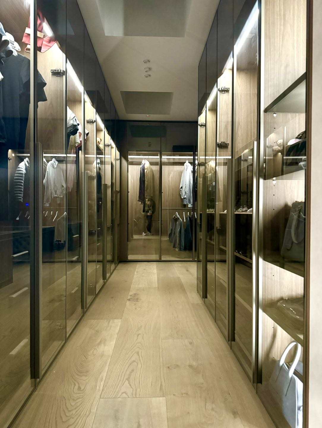 Melbourne's high-end whole house customization luxurious walk-in closet with wooden panels and LED lighting
