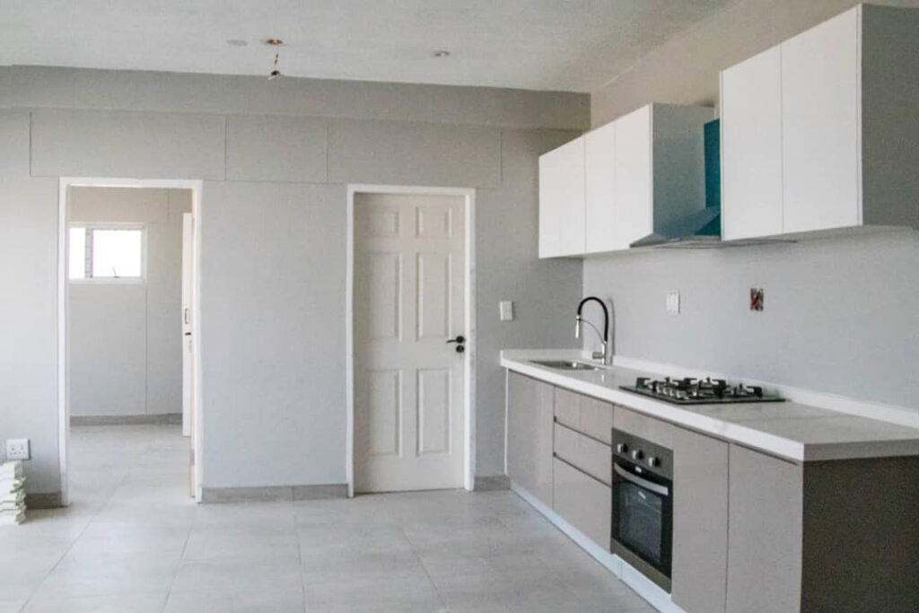 48 Sets Custom Cabinets for Ongwe Holiday Apartment in Namibia 1 Organized kitchen cabinets with efficient space utilization in Ongwe Apartment.