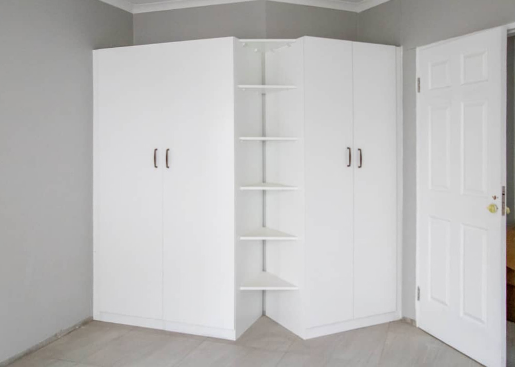 48 Sets Custom Cabinets for Ongwe Holiday Apartment in Namibia 6 Interior of custom wardrobe with shelves and hanging space in Ongwe Apartment.