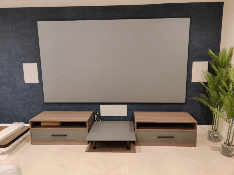 UK custom tv unit with walnut storage modules and gray media shelf