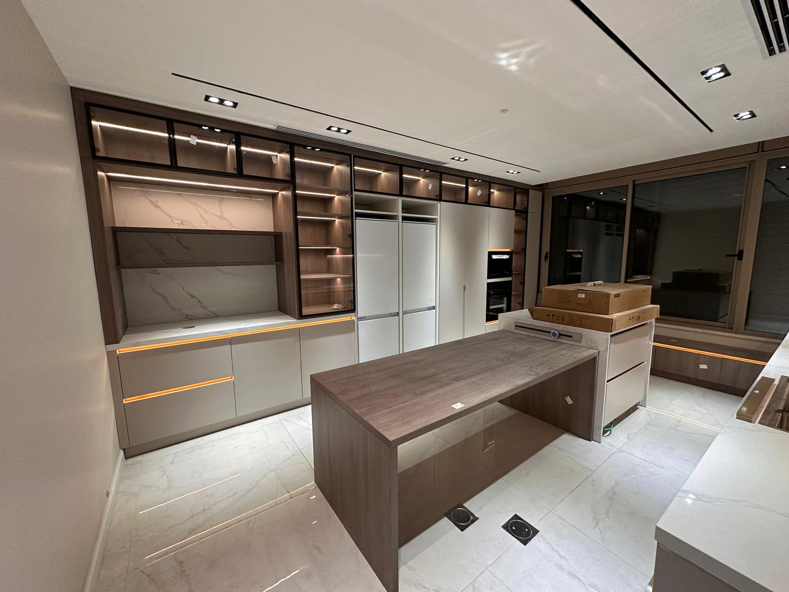 Kitchen with high-end custom kitchen cabinets and lighting in Palestine custom cabinet project.