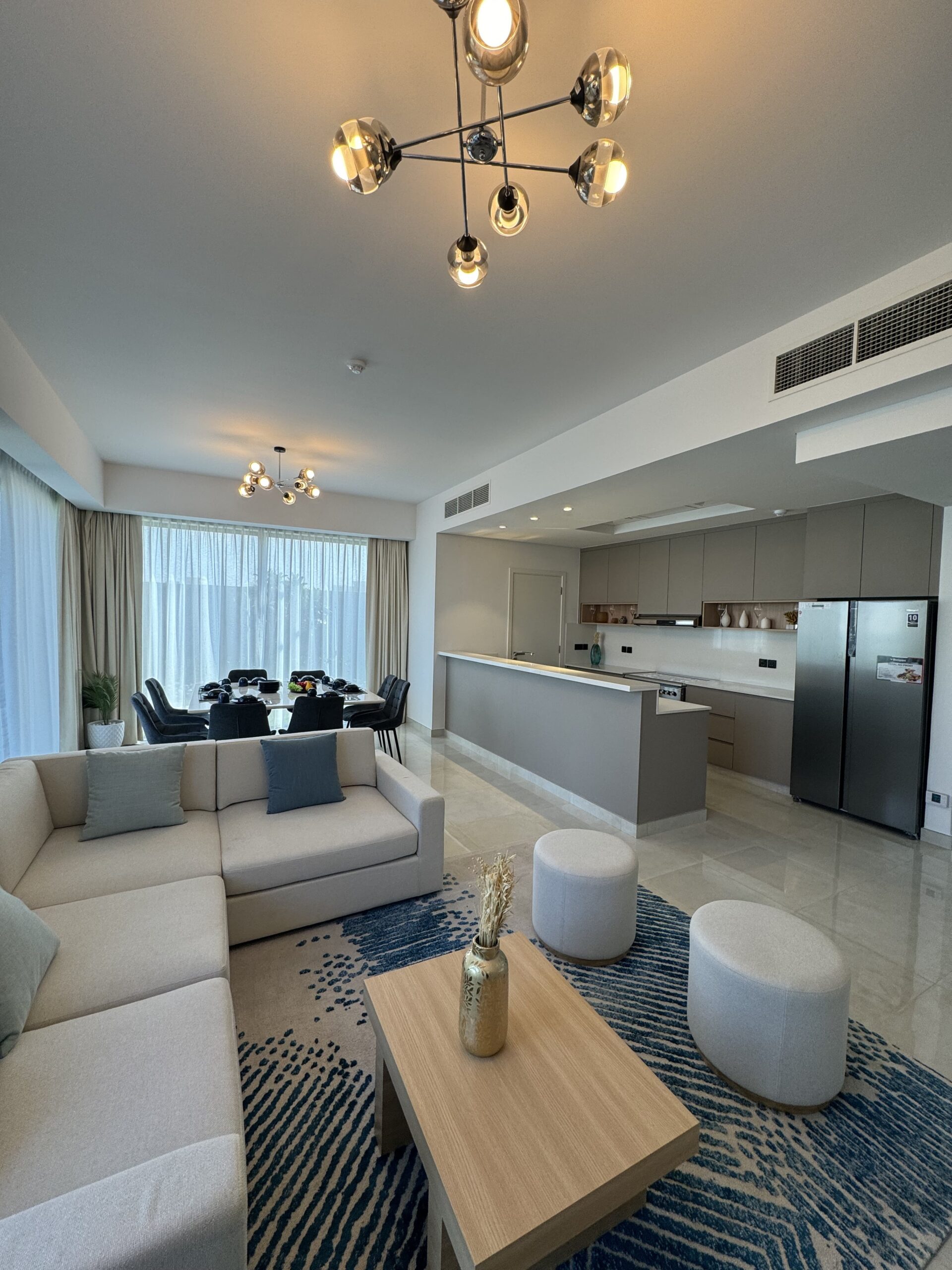 Spacious living room with custom cabinetry and furniture designed for comfort and style in a Dubai custom cabinet project.