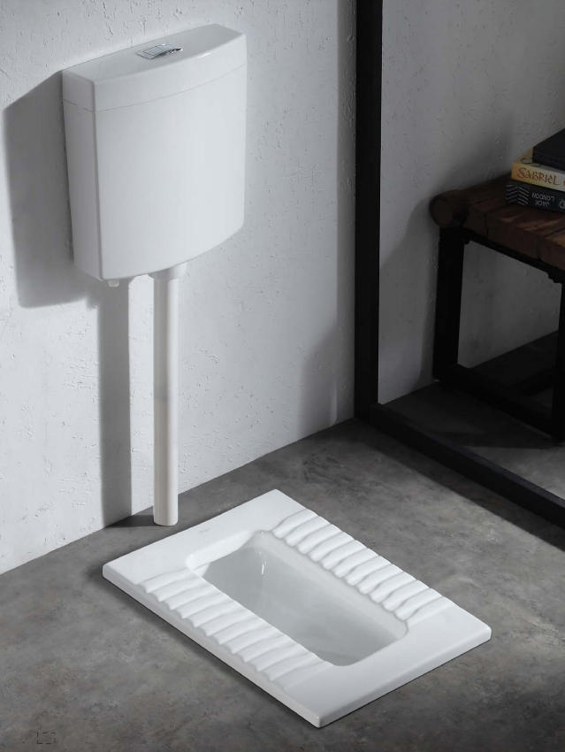 PAhome white ceramic squatting pan with non-slip textured footrests raised above the floor.