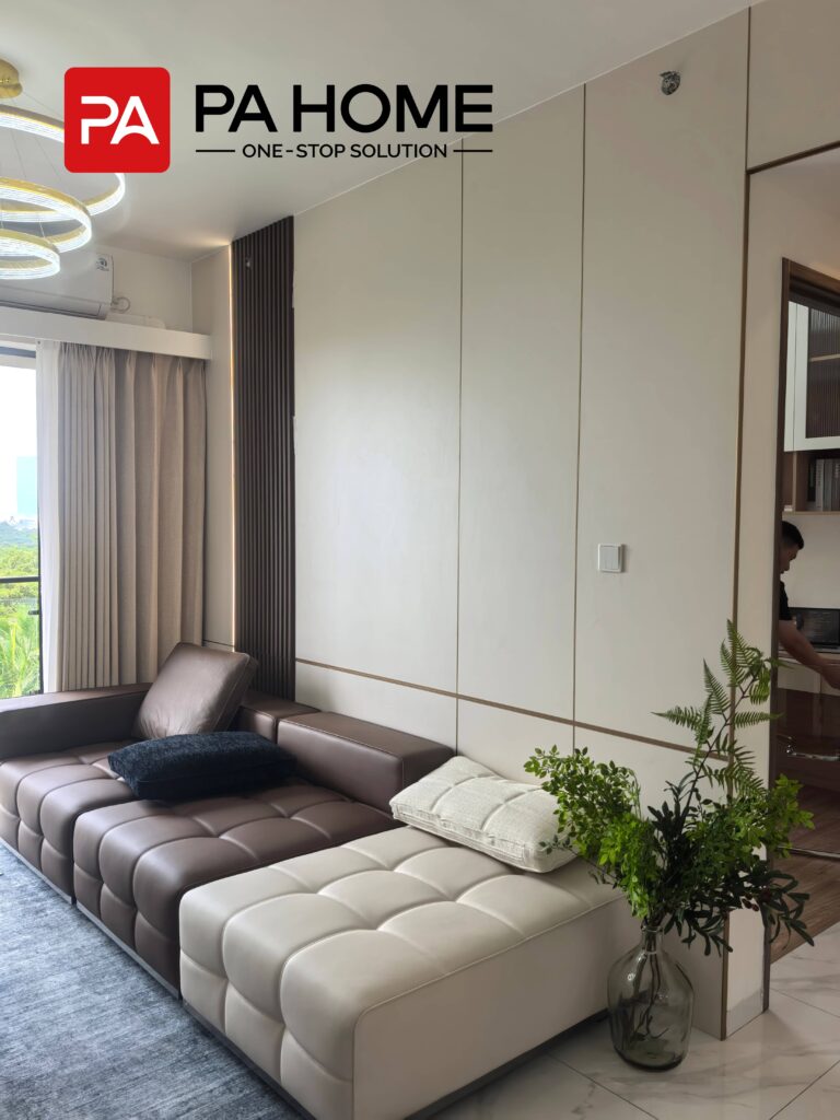 Elegant Tangerang Whole House Custom Interior Project 8 Tangerang living room with custom wall panels, decorative lighting, sofa area, and modern interior design.