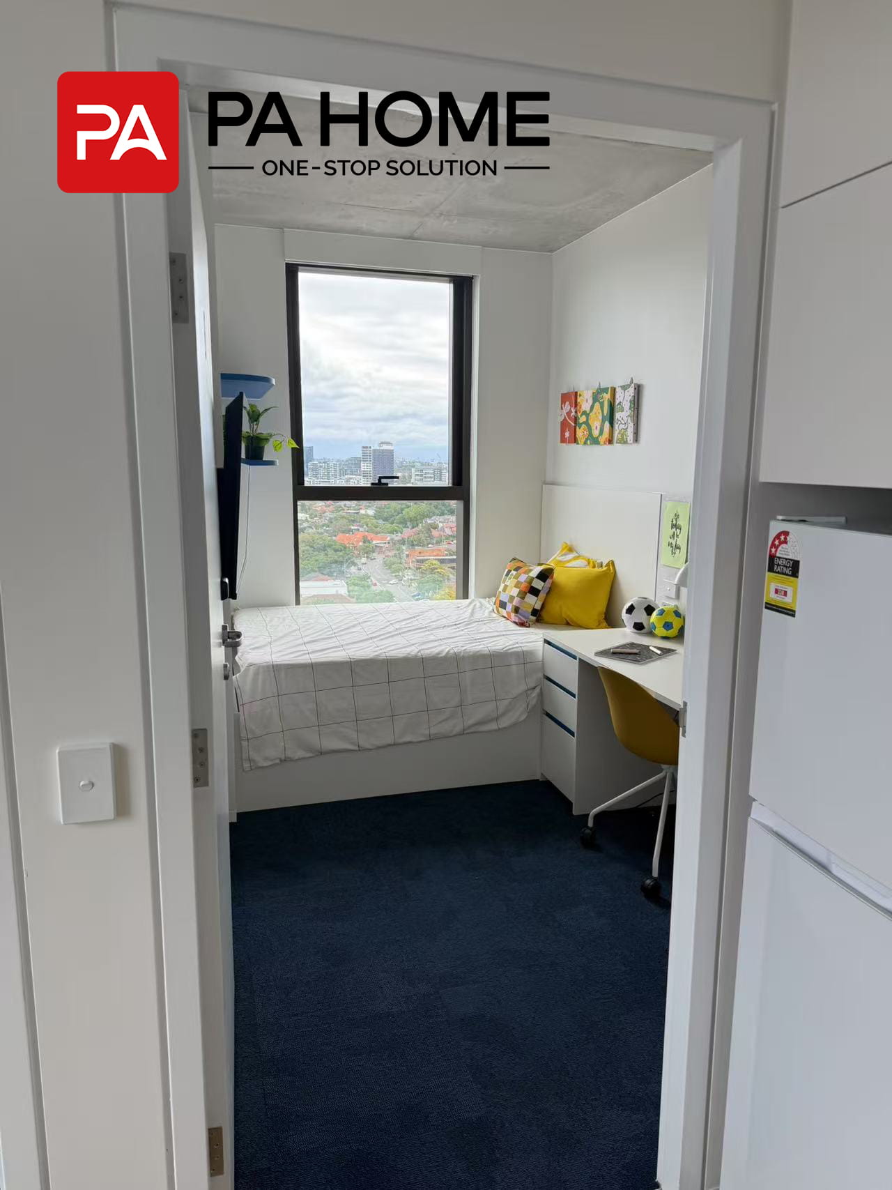 Custom Furniture & Cabinetry for 308-Unit Student Apartment Project in Sydney 4 Student bedroom in Sydney with custom furniture and an awning window offering city views.