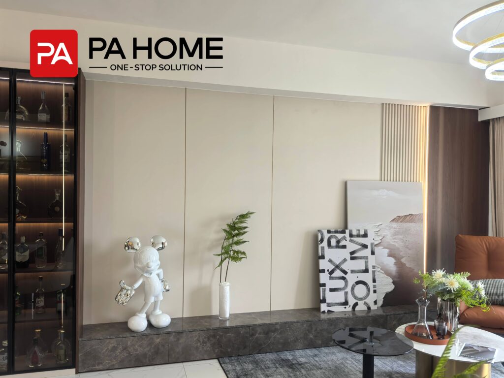 Elegant Tangerang Whole House Custom Interior Project 9 Tangerang living room with custom wall panels, low TV cabinet, glass display cabinet, and decorative lighting.