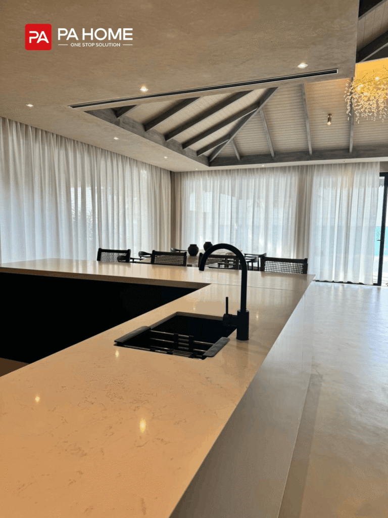 Maldives Villa Heaven Resort Whole House Customization Project 4 matte black faucet and undermount sink on kitchen island with dining backdrop