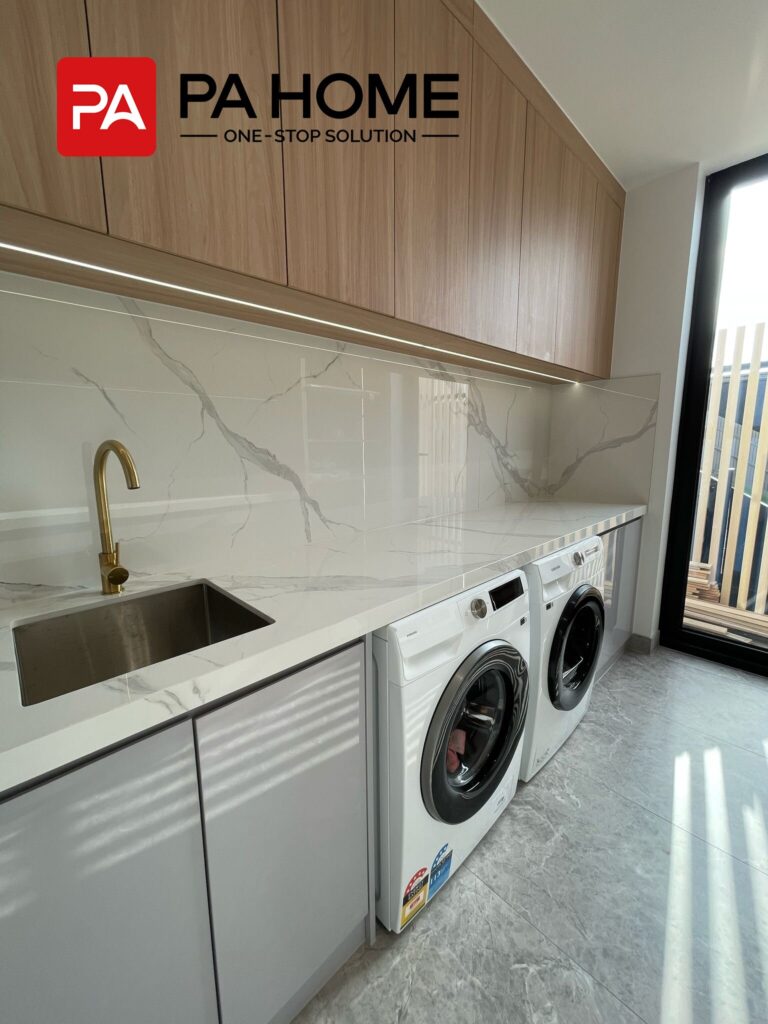 Luxury Whole House Custom in Melbourne 18 laundry room custom joinery under-sink storage with overhead cabinets