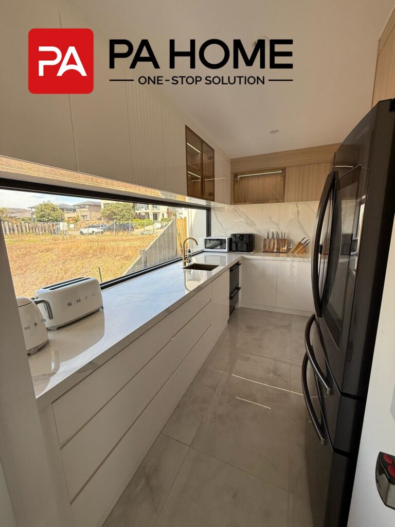 Luxury Whole House Custom in Melbourne 7 galley kitchen with marble countertop and timber-accent cabinets