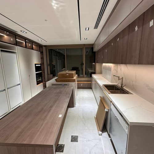Fully equipped kitchen with modern custom kitchen cabinets in Palestine custom cabinet project