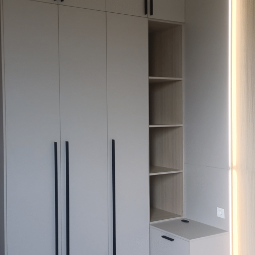Indonesia Full House Customization - Bedroom with custom storage units and clean modern finishes and light.