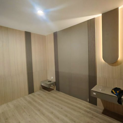 Bedroom with custom wall panels and minimalistic design, part of Indonesia Full House Customization project.