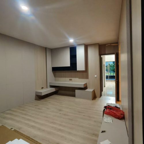 Custom wall panels and sleek furniture in a bedroom from Indonesia Full House Customization project.