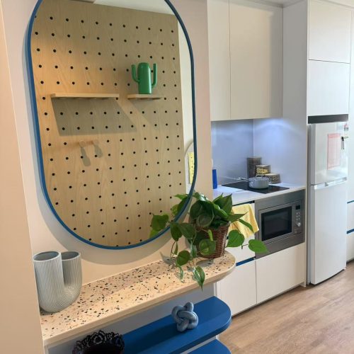 Custom bedroom storage solutions, including shelves and drawers, in a student apartment in Sydney.
