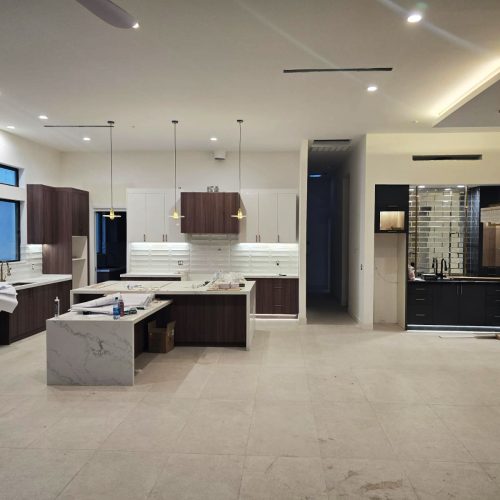 Custom living room with contemporary design, minimalist furniture, and modern lighting.