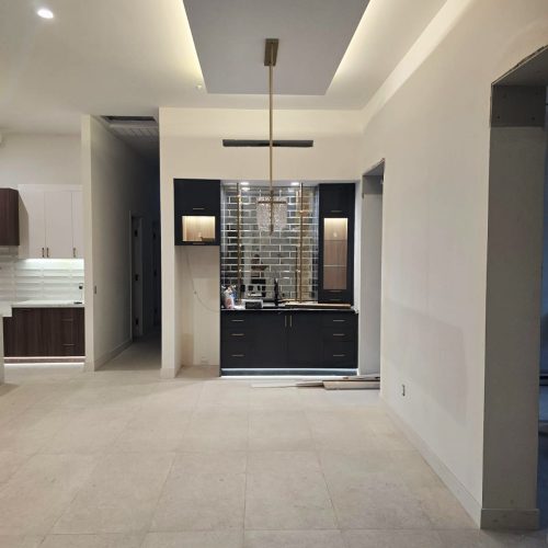 Custom living room with contemporary design, minimalist furniture, and modern lighting.