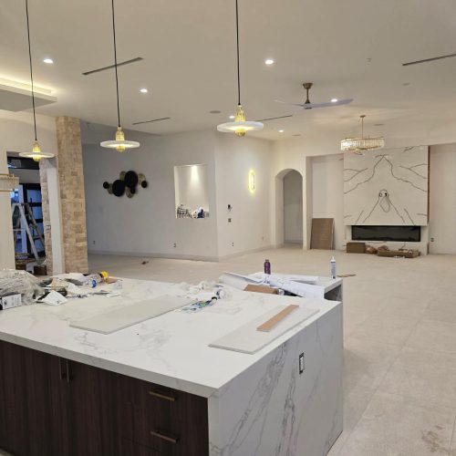 Full House Custom In America living room with a feature wall and modern furnishings.