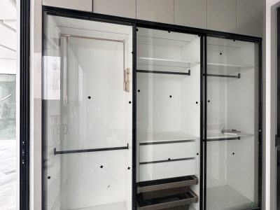 Indonesia Mirrored Room Custom Cabinets 2 Stylish custom wardrobe with mirrored doors and wood accents in an Indonesia mirrored room.