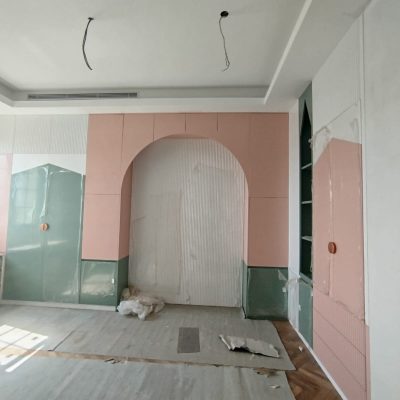 In this Indonesia full house custom project, the green wardrobe and storage cabinet complement the pink wardrobe and wall, creating a harmonious and vibrant contrast in the space.