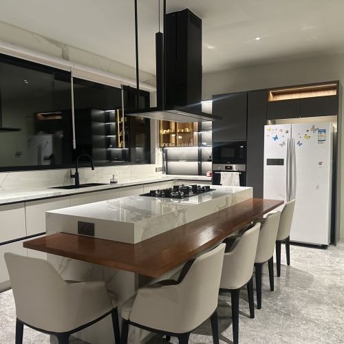 kitchen cabinetry with ambient lighting at dusk