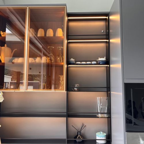 kitchen display cabinet with tinted glass doors and backlit shelves