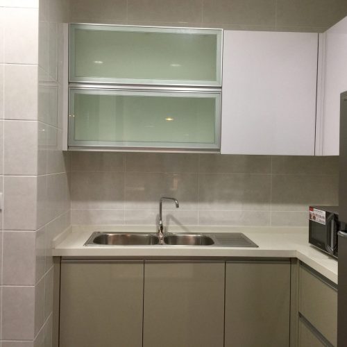 Double stainless sink beneath frosted glass cabinets in Kuching apartment whole house custom kitchen