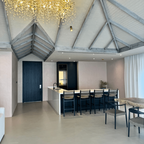 maldives villa whole house custom open plan kitchen island with bar seating under vaulted ceiling