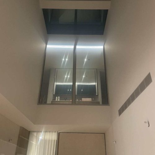 Melbourne's high-end whole house customization sleek bathroom with glass shower and ambient lighting
