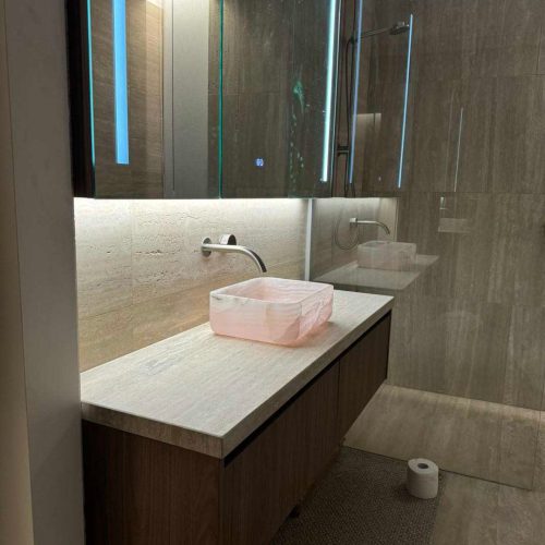 Melbourne's high-end whole house customization elegant bathroom with modern finishes and lighting