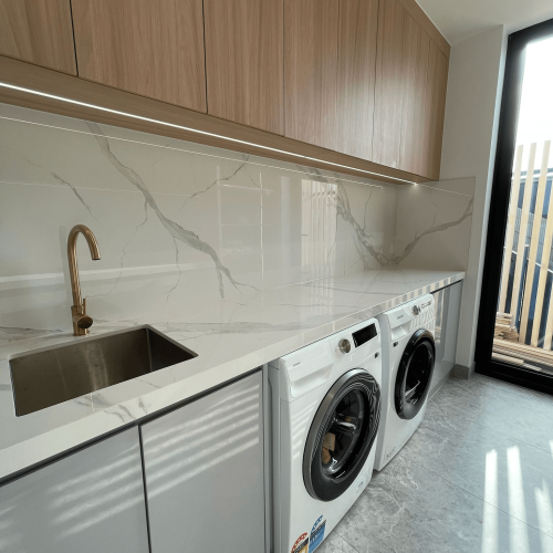 Luxury Whole House Custom in Melbourne 6 laundry room custom joinery under-sink storage with overhead cabinets