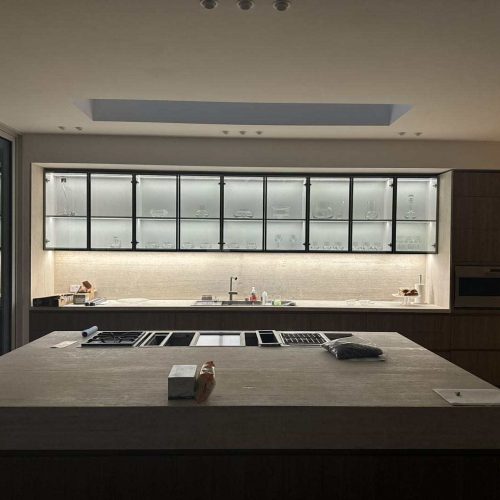 Melbourne's high-end whole house customization custom kitchen cabinetry with glass-front upper cabinets