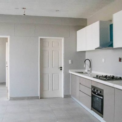 Organized kitchen cabinets with efficient space utilization in Ongwe Apartment.