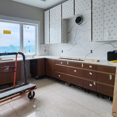 Pittsburgh High-end Whole House Custom in America 4 High-end custom kitchen cabinet design in Pittsburgh with black finishes and premium marble countertops.