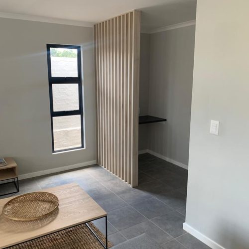 SouthAfrica 29 Units Whole House Custom 3 South Africa whole house project featuring a wooden slat room divider for an open living area.