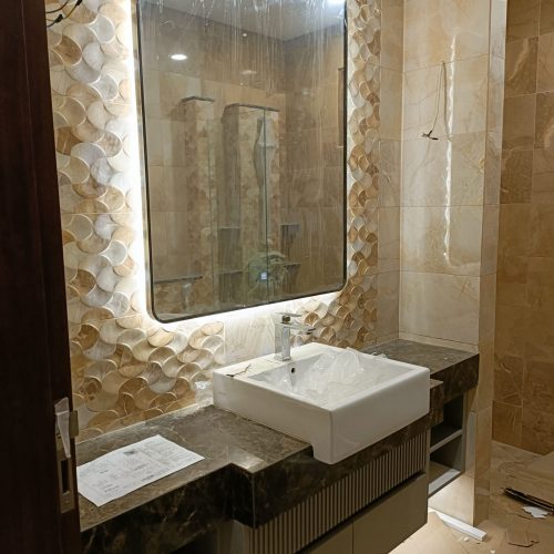 Elegant custom bathroom vanity design with integrated storage and polished marble countertop.