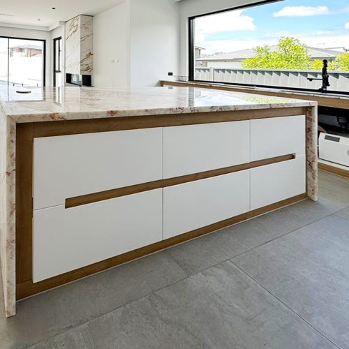 Marble waterfall white kitchen island custom cabinets in Sydney