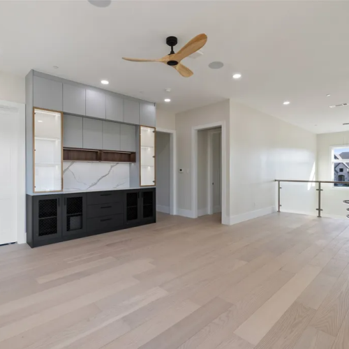 Texas Luxury full house custom in America 2 Open-concept custom cabinet system with marble backsplash and illuminated glass display shelves