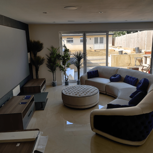 angled view of UK custom tv units with integrated modules and plants