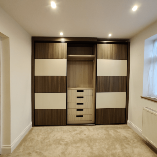 wardrobe interior view with sliding door open showing drawers and rail