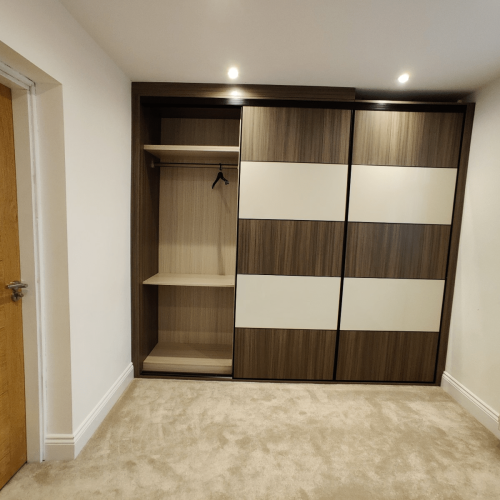 full wardrobe open panel revealing hanging space and pull-out shelves