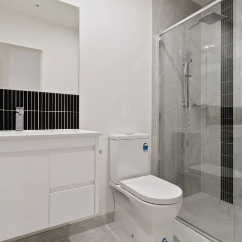 Australia Parkview Apartment Custom Cabinets Project spacious bathroom with custom vanity and vertical black accent tiles
