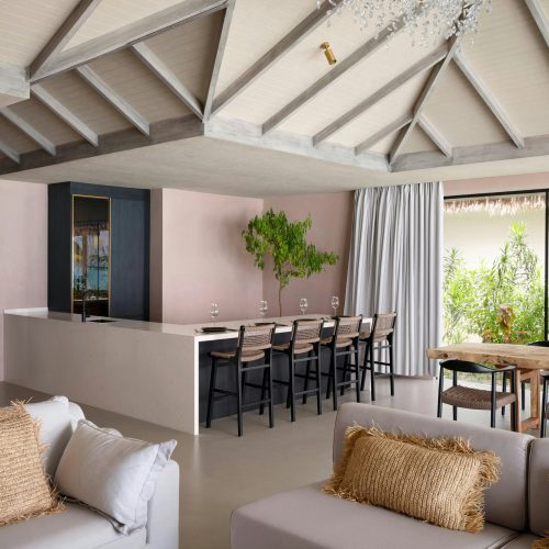 maldives villa whole house custom open plan living area with kitchen island and dining table