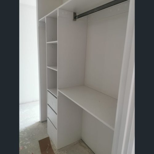 Melbourne Parkview Apartment Custom Cabinets Project white wardrobe with shelves and hanging space in bedroom closet