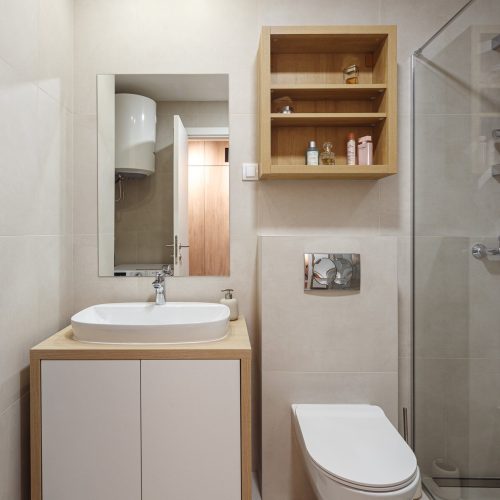 Modern bathroom with a sink and custom cabinet in the Zemun stan apartment project.