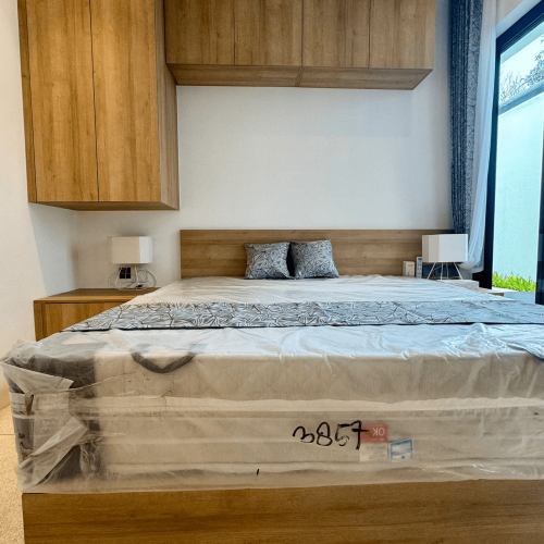 Stylish bedroom with a custom nightstand and modern design in a Bali project.