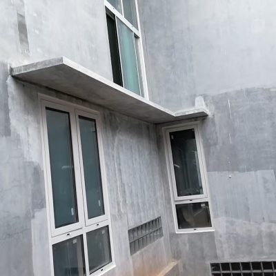 White Aluminum Windows Installation for Luxury Villa in Bogor 5 Close-up of a white aluminum tilt and turn window in the villa project in Bogor, Indonesia, showcasing its sleek design.