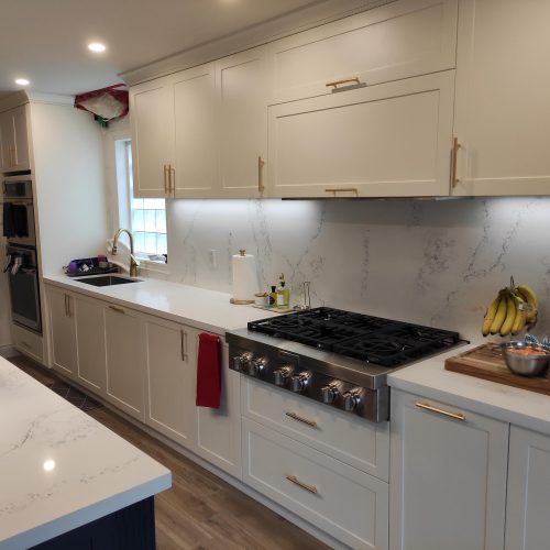 custom kitchen cabinet in Canada with stainless steel appliances and marble countertops
