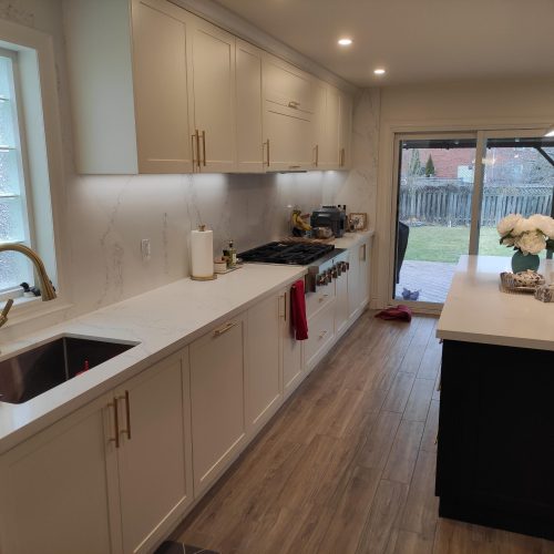 custom kitchen cabinet Canada with a modern design and gold handles